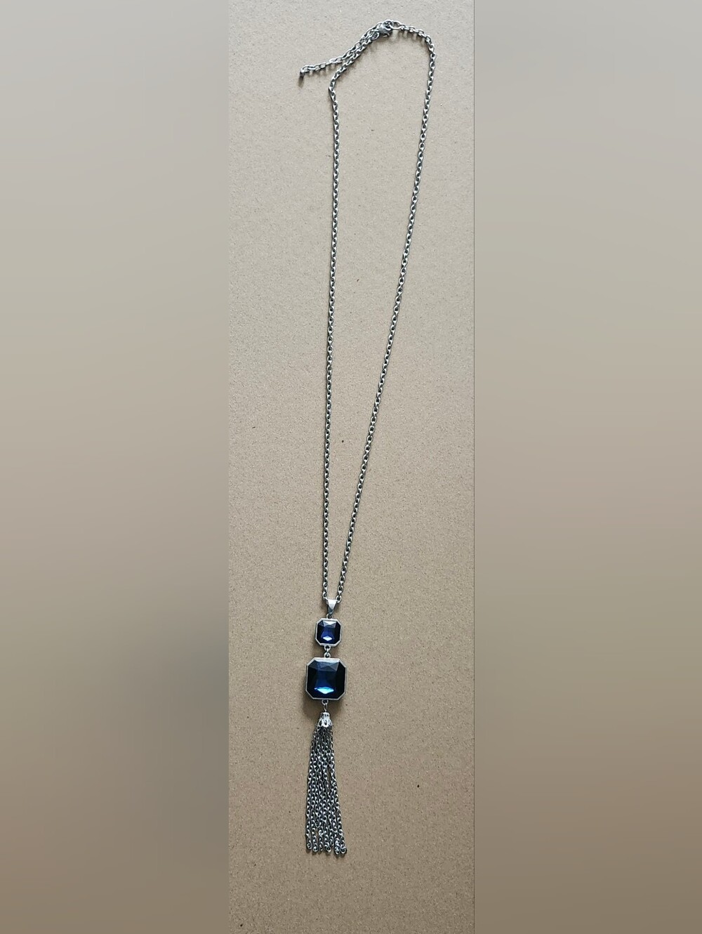Kenneth Cole Silver Necklace with Blue Faceted Stones and Tassel